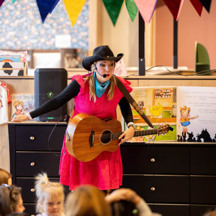 Miss Jamie singing at The Wayfair Store.