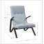 Fauteuil capitonné en tissu bleu clair