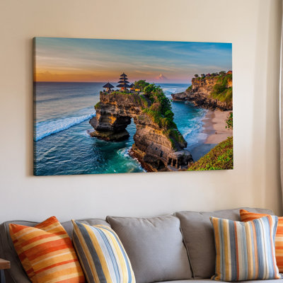 Canvas A Breathtaking Coastal Scene At Sunset Featuring A Majestic Temple Wall Art Perched On A Rugged Cliff Surrounded By Lush Canvas Wall Art