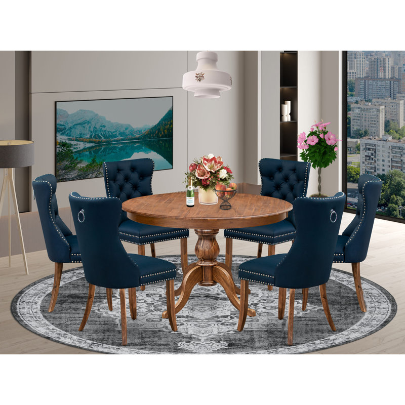 L'ensemble de salle à manger moderne de 7 pièces comprend une table ronde de 48 po au fini noyer antique, accompagnée de 6 chaises en polyester bleu marine avec un dossier élégamment capitonné.