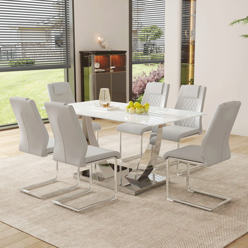Ensemble de table et de chaises, table de salle à manger rectangulaire simple en verre moderne, plateau de table en verre marbré blanc de 0,4 pouce d'épaisseur, assorti à des chaises en polyuréthane de haute qualité avec des pieds en métal arqués.