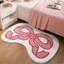 Tapis de bain pelucheux rose
