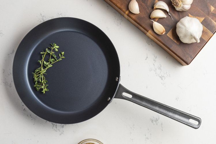 carbon steel pan on a marble countertop