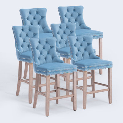 Tabouret de bar rembourré en velours avec dossier capitonné