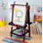 Deluxe Wooden Easel with Chalkboard and Dry Erase Surfaces, Paper Roll and Paint Cups-10894411