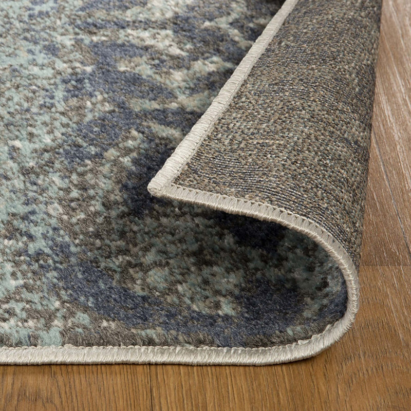 Tapis bleu sarcelle damassé résistant aux taches