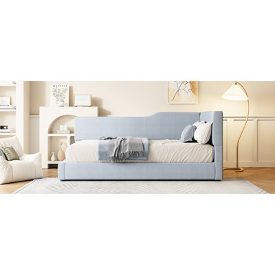 Lit de jour gris simple avec revêtement en velours côtelé et structure en L - une option de détente élégante