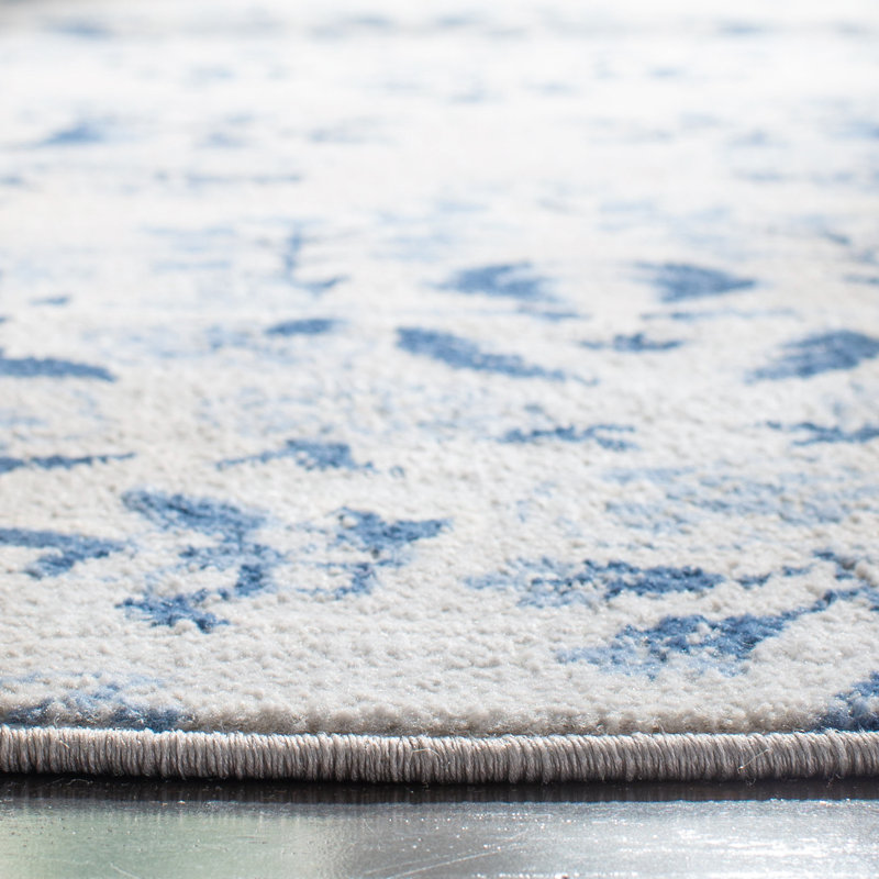 Blue and Cream Floral Synthetic 11' x 15' Area Rug
