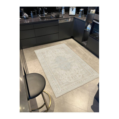 Tapis crème lavable à la machine à motif géométrique crème