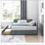 Lit double capitonné avec rangement, dossier, accoudoirs et revêtement en velours gris, au design confortable comme un canapé.