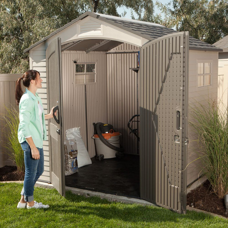 Tan and Brown Polyethylene Outdoor Storage Shed with Shelving and Windows