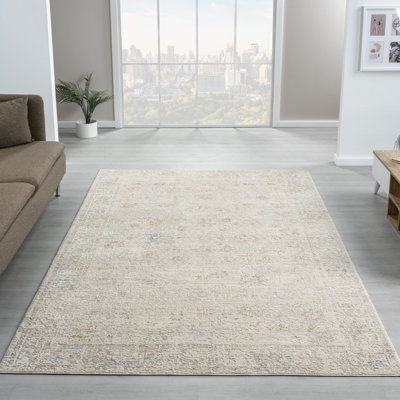 Tapis tissé à la machine Melby ivoire / beige à motif floral traditionnel Melby