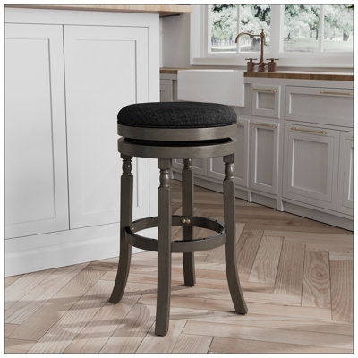 Tabouret de bar de 30 pouces avec finition gris patiné et siège en tissu gris anthracite, combinant élégance traditionnelle et confort moderne pour toute maison