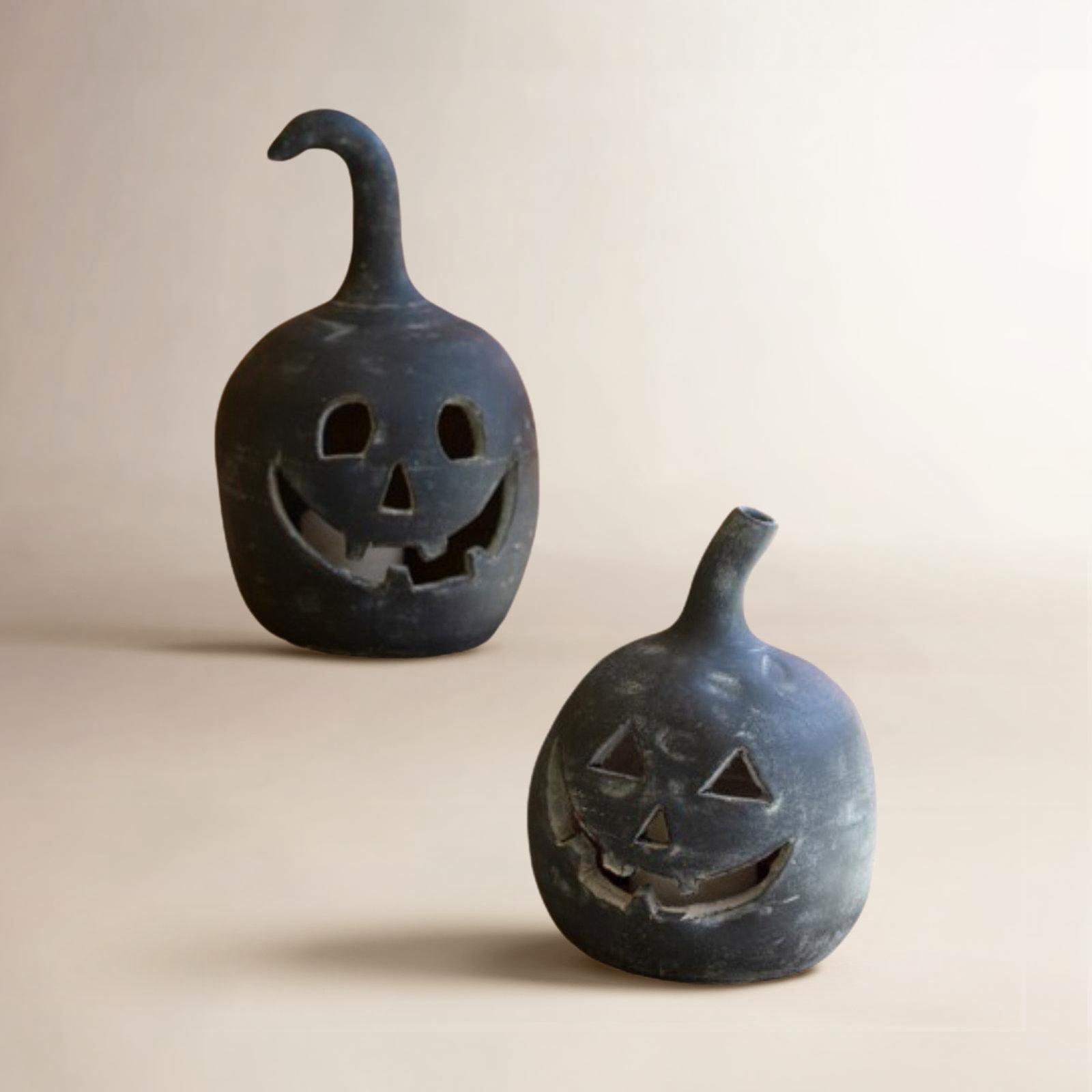 SET OF TWO BLACK CLAY JACK-O-LANTERNS