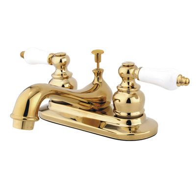 Kingston Brass Restoration Two-Handle 3-Hole Deck Mount 4" Centerset Bathroom Faucet with Plastic Pop-Up