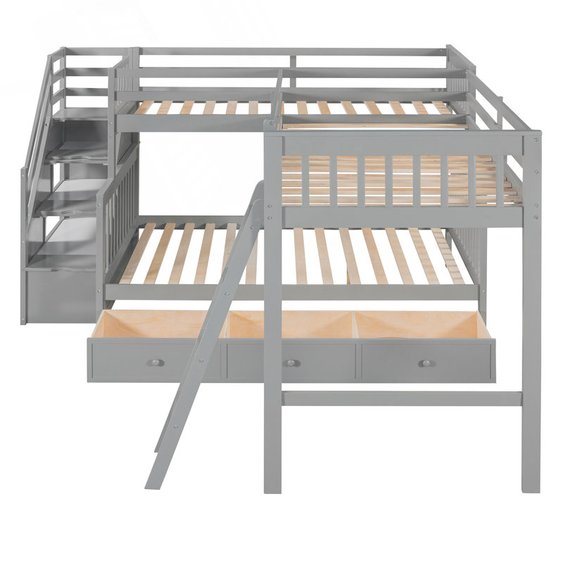 Lit superposé simple au-dessus d'un lit double en L avec tiroirs, échelle et escalier pour une utilisation optimale de l'espace et un confort familial