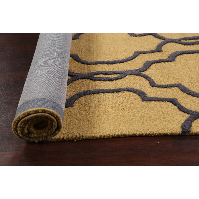 Tapis géométrique doré en laine touffeté à la main