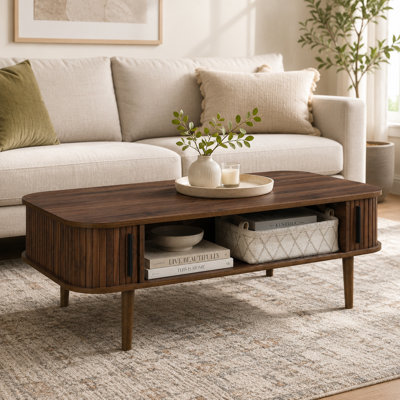Aguilera 47.2" W Mid Century Coffee Table with Storage and Fluted Sliding Door