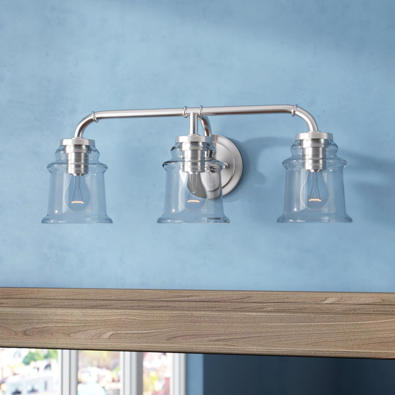 Akini 3-Light 22 inch Wide Satin Nickel Industrial Bathroom Vanity Lighting Fixture, Clear Glass Shade, Dimmable, LED Compatible, Over the Mirror Mounted Steel Wall Sconce