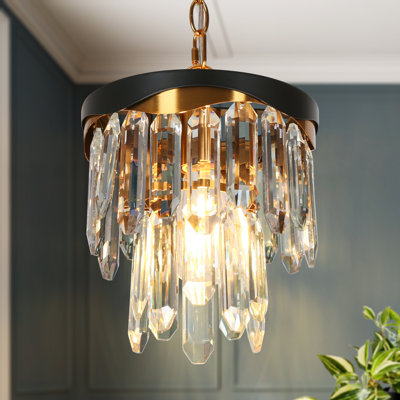 Suspension Grigor à une lumière en cristal, style moderne noir et laiton, à intensité variable, idéale pour îlot de cuisine.