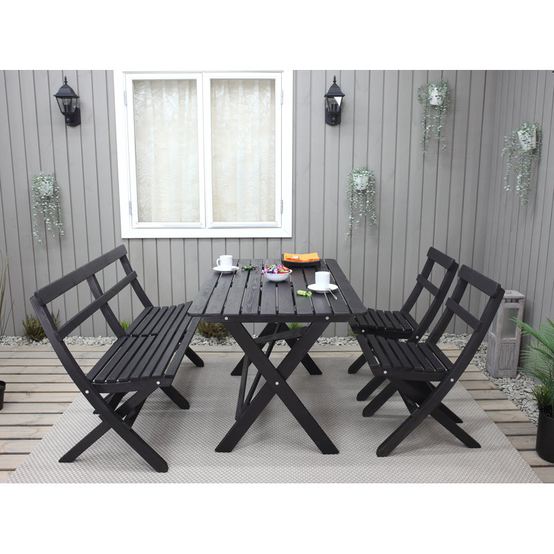 Delia 4 - Person Solid Wood Patio Dining Set Rectangular Table, Black