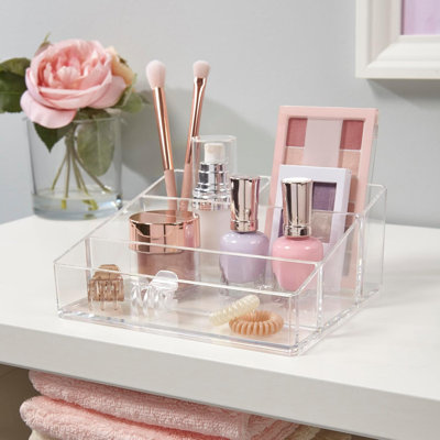 Organisateur de maquillage de comptoir en plastique transparent, petit format rectangulaire à 4 compartiments pour pinceaux, palettes de fards à paupières et autres produits de beauté.