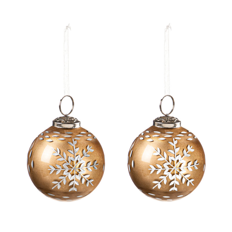 Ornement boule de verre en forme de flocon de neige dans une boîte cadeau
