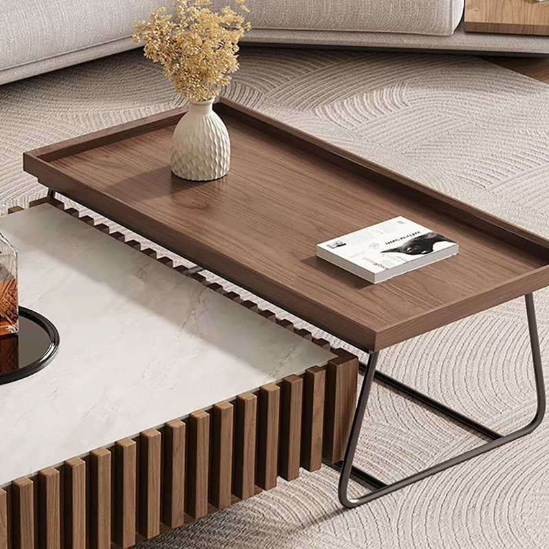 A mid-style walnut-colored coffee table set