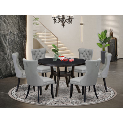 L'ensemble de table de salle à manger 7 pièces comprend une table ronde de 48 po avec piédestal et 6 chaises rembourrées en similicuir gris clair, noir sablé