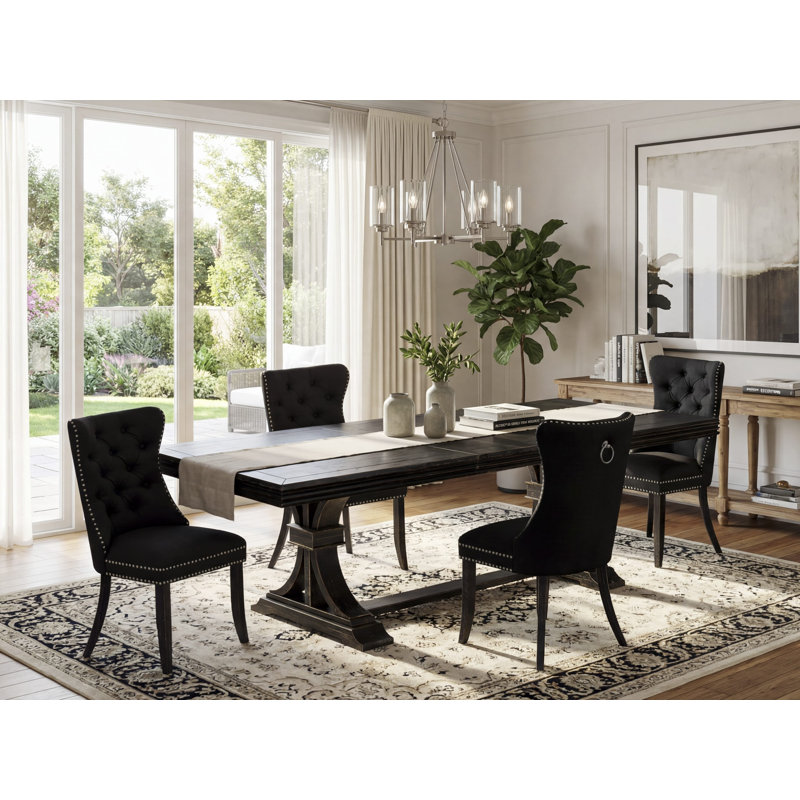 5-piece dining set includes a rectangular table and 4 Black Polyester fabric dining Chairs with Button Tufted Chair Back - Sand Blasting Black Finish.