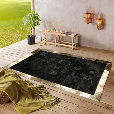 Black Genuine Cowhide Rug With Gold Border