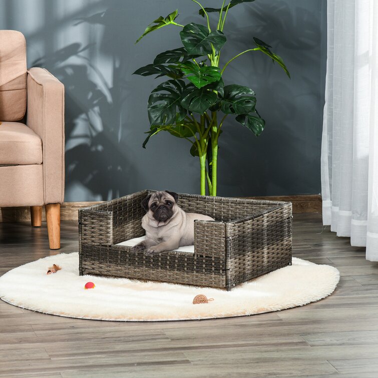 https://assets.wfcdn.com/im/50413648/resize-h755-w755%5Ecompr-r85/1637/163790766/Cadel+Rattan+Pet+Bed+Raised+Wicker+Small+Animal+Indoor+%26+Outdoor+with+Soft+Water-Resistant+Cushion+Dog+Sofa.jpg