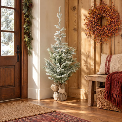 Snow-Tipped Faux Pine Tree in Burlap Sack