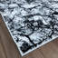 Tapis abstrait en jute tissé à la machine en noir / blanc-315797880