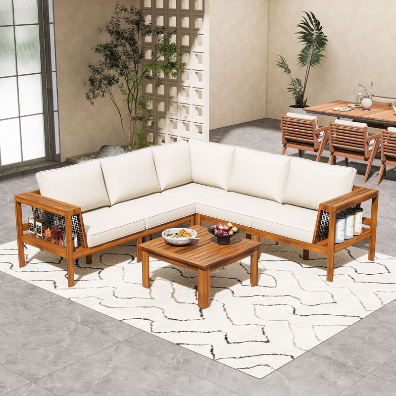 Ensemble de conversation modulaire en L 4 pièces en bois d'acacia avec table basse et coussins pour patio, terrasse ou bord de piscine