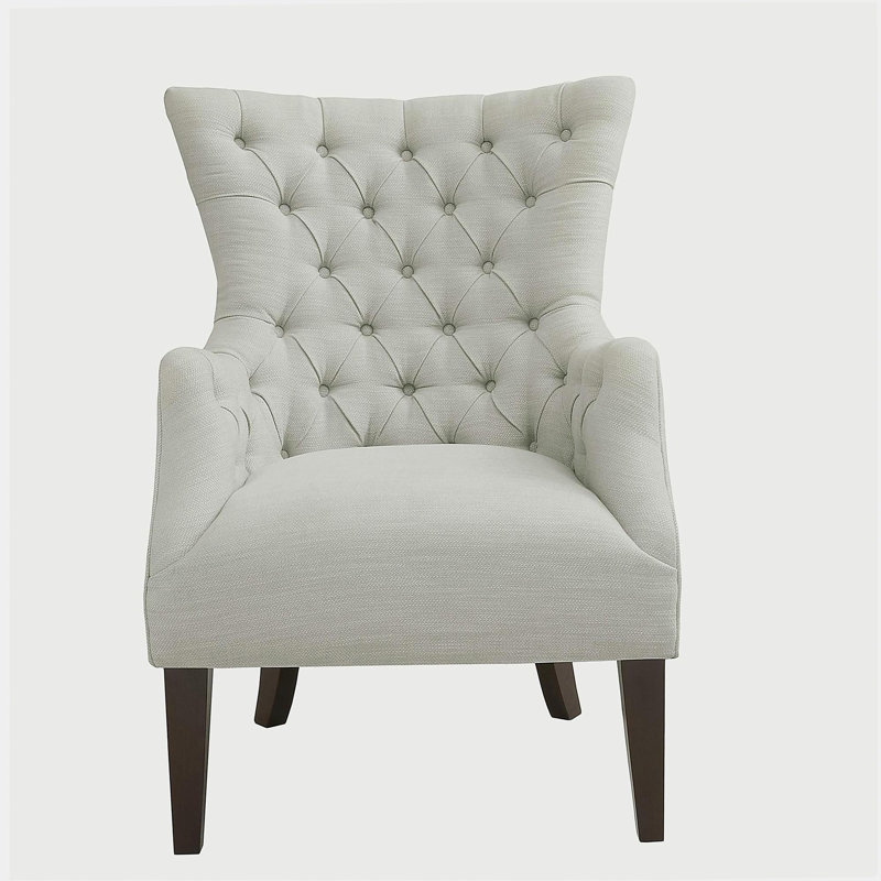 Fauteuil à oreilles capitonné