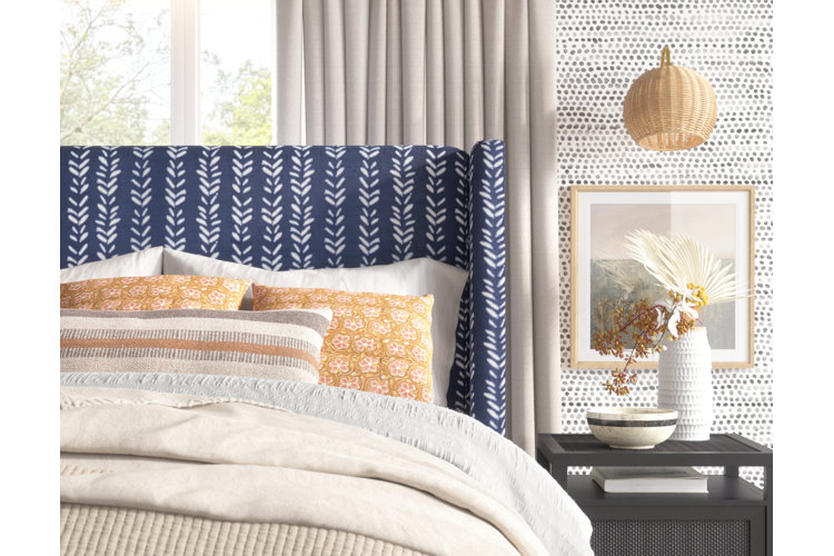 Bedroom with marigold shams, lumbar pillow and fake plant