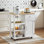 31.5*35.2*15.7 Kitchen Island Kitchen Cart With Three Shelves, One Drawer And One Cabinet, With Universal Pulleys, Equipped With Towel Rack And Side Hooks