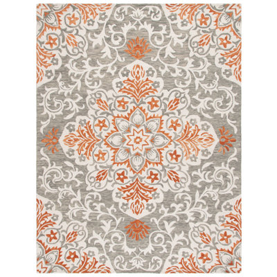 Oltiana Hand Tufted Wool/Cotton Floral Rug in Rust/White/Gray