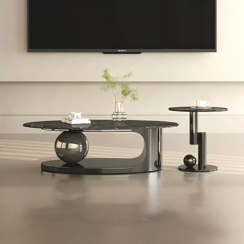 Table basse ovale minimaliste en acier inoxydable avec plateau en pierre noire super-cristallisée