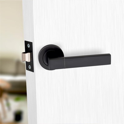 1 Pair Capri Design Door Handles on Round Rose in Matt Black Finish with 2.5" Tubular Latch - 52mm Diameter
