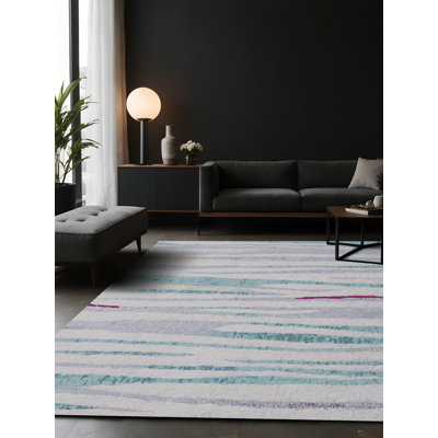 Tapis gris soyeux et moelleux