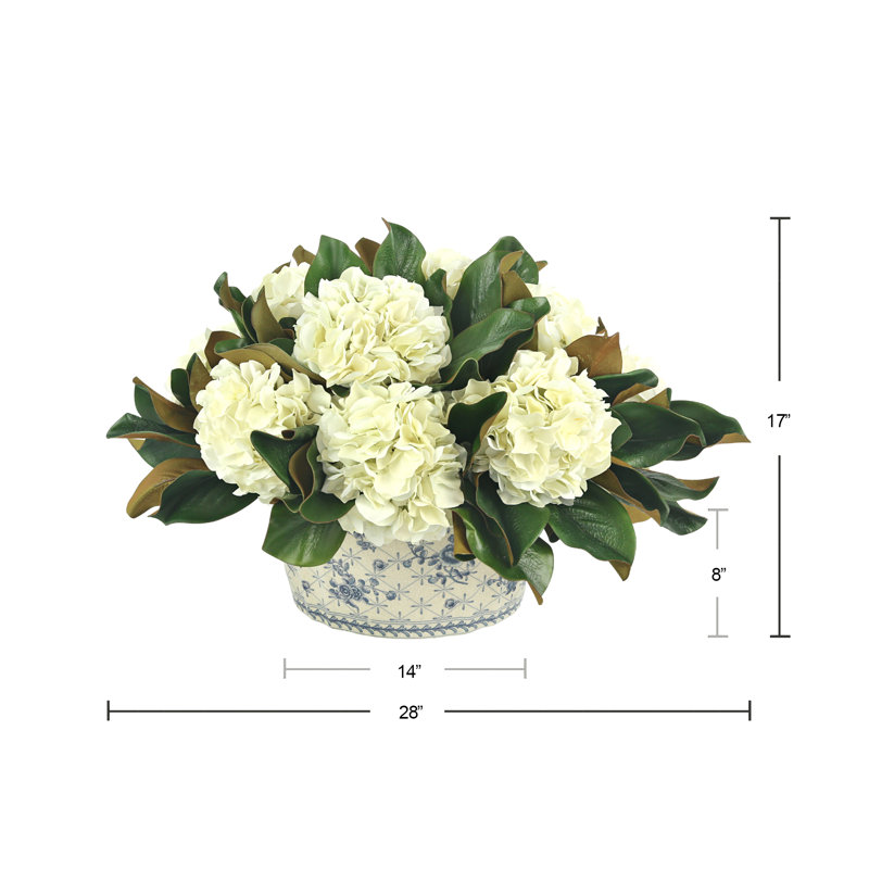 Hydrangeas and Magnolia Leaves Arranged in Decorative Vase