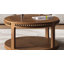Table basse ronde avec plateau épaissi à deux niveaux, pieds robustes et motif perlé-409835473