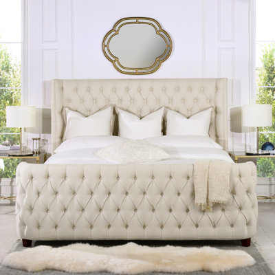 Currier Upholstered Wingback Bed