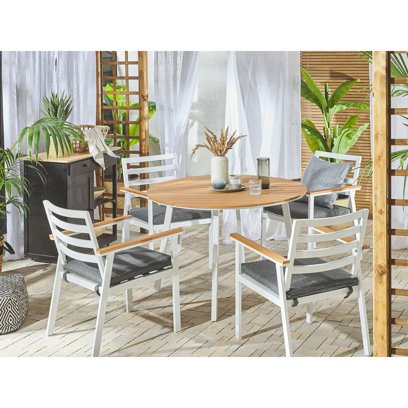Fardy 4 - Person Patio Dining Set with Round Table , Cushions Included