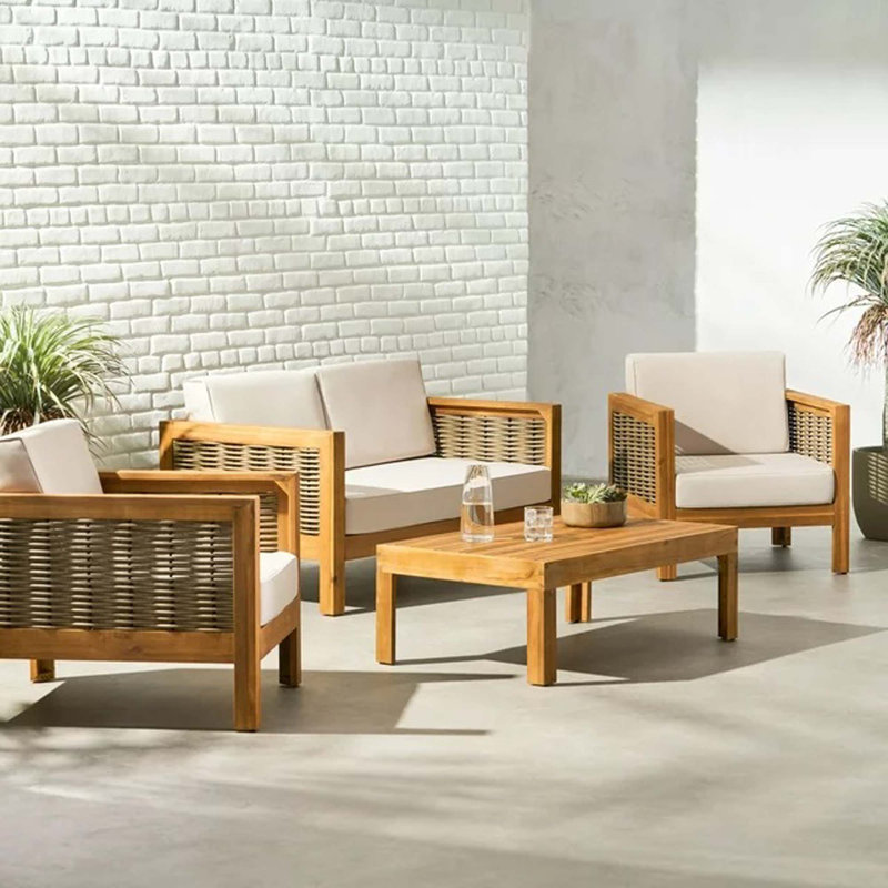 Ensemble de conversation d'extérieur 4 places en bois d'acacia avec accents et coussins en osier