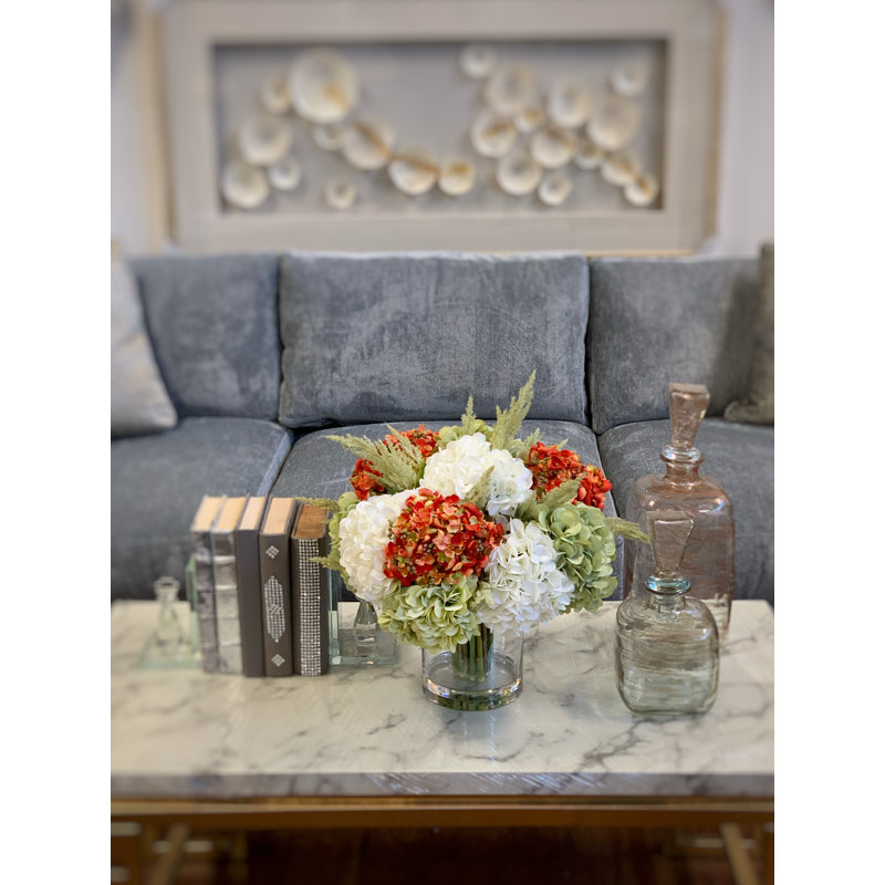 Assorted Hydrangea In A Round Vase