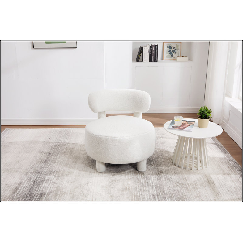 Fauteuil d'appoint sans accoudoirs en tissu Teddy avec dossier incurvé et pieds en bois massif pour un confort et un style optimaux dans les espaces de vie.