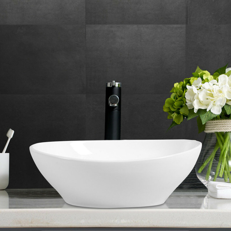 Lavabo de salle de bain ovale en céramique blanche et trop-plein